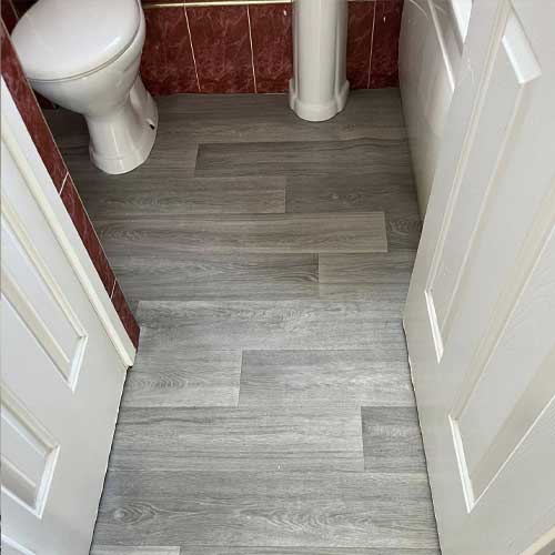 HCC Handy Man Services new floor in toilet